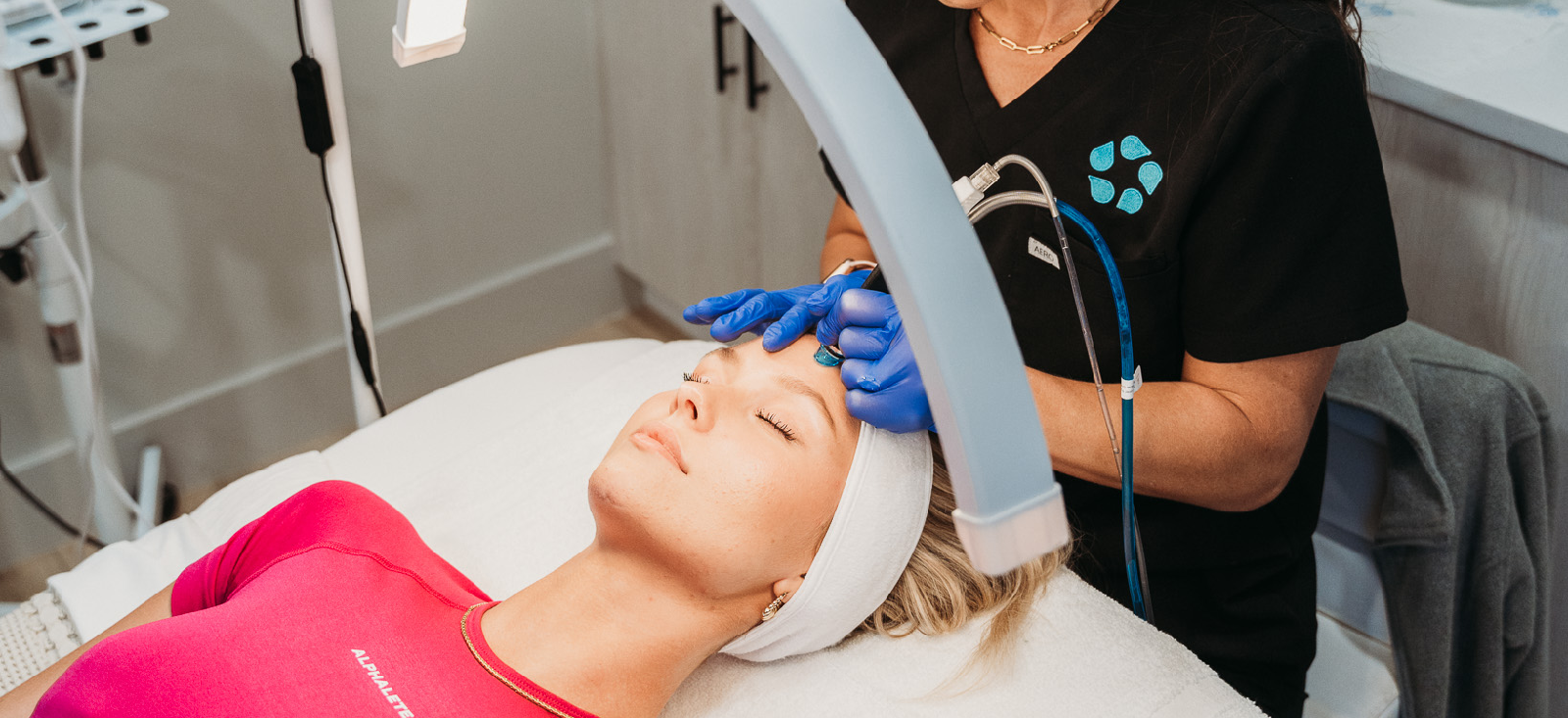 relive health hendersonville medspa employee administering Hydrafacial treatment to patient 1600x733 1
